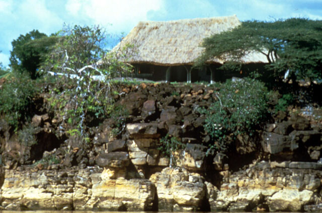 The house sits on a bed of rock overlooking the water