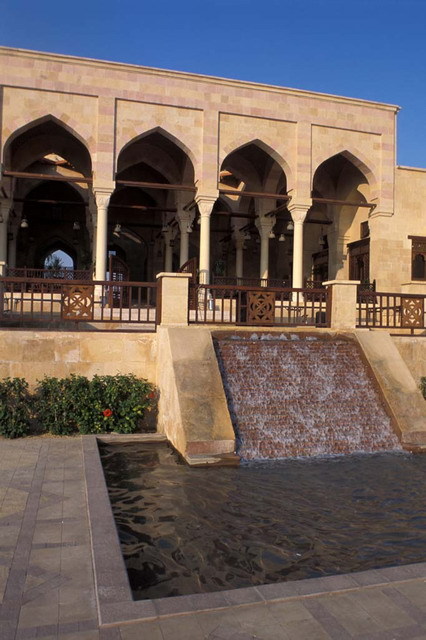 Partial exterior view from south, showing waterfall and pool before portico (<i>takhtaboush</i>)
