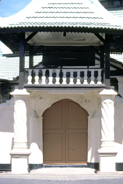 Close up of entry gate with closed doors and bedug drum on lookout
