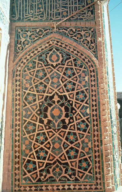 Detail of pishtaq; tile mosaic and inscription on right flank