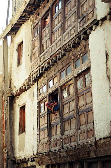 Vernacular Housing of Kabul - Street view of house in Hindu Gozar area, with girls looking out window