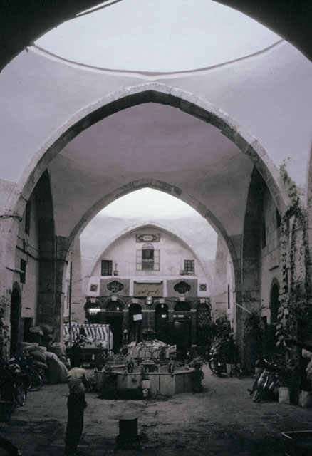 Interior courtyard view towards west showing series of arches