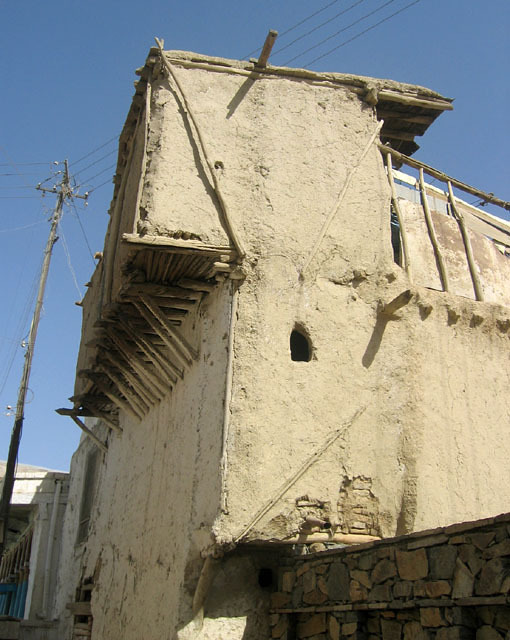 Vernacular Housing of Kabul - Street view of timber-frame house with corbelled overhang