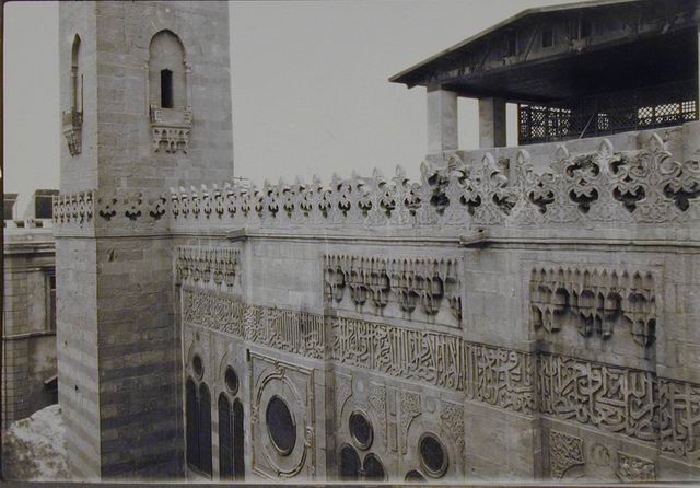 Exterior view of mosque-madrasa, showing upper section of the east (al-Muizz Street) façade with minaret