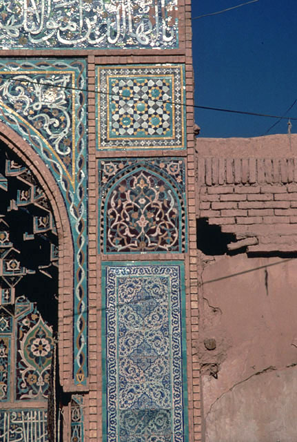 Detail of pishtaq; arabesque tile panels and tile mosaic