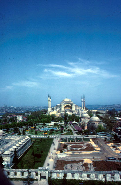Elevated view of Haseki Hürrem Baths and the Hagia Sophia, as seen from the minaret of the Sultanahmet Mosque to the southwest; the madrasa and precinct walls of the Sultan Ahmed I complex appear in the foreground