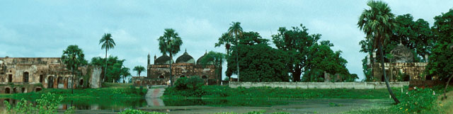 From east looking across tank. Left to right - hammam, mosque, tomb