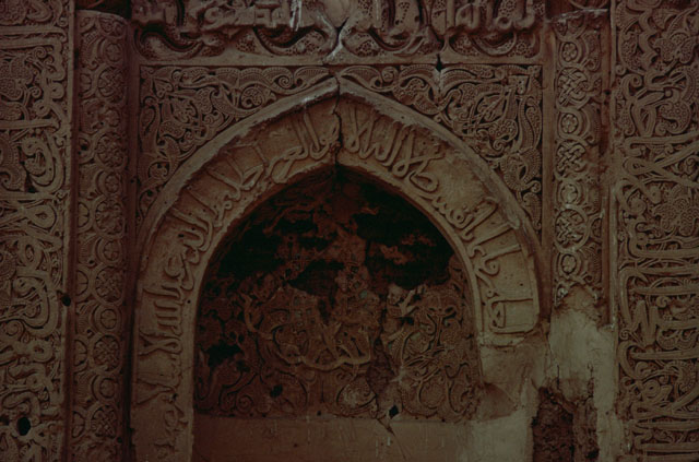 Detail of mihrab, floral arabesques and inscriptions decorating niche