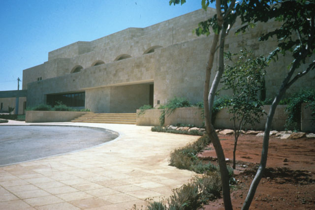Exterior view showing approach and entrance and massing of rectilinear forms