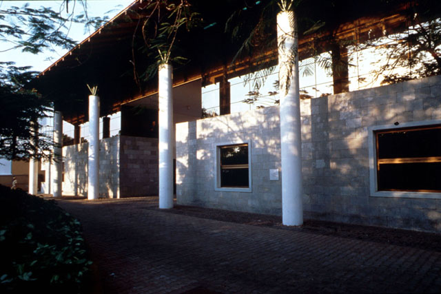 Exterior view showing two story pillars supporting projection