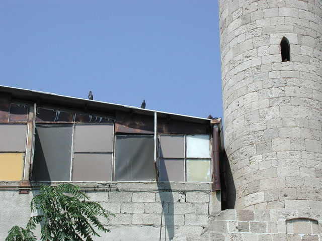 Partial view of minaret with adjacent building