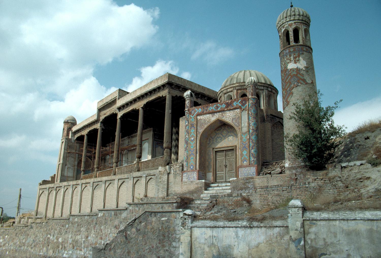 Exterior view of mosque looking towards portico and adjacent tower