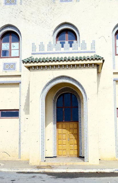 Exterior view of façade showing tile work and entrance