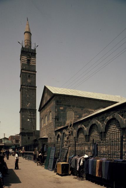 South wall of main prayer hall and minaret from outside the complex