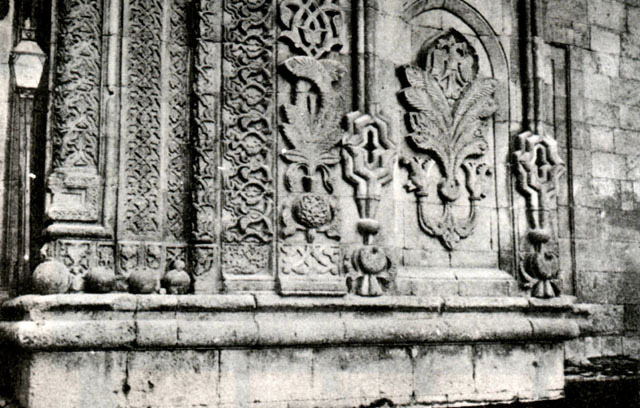 Exterior detail, carved floral panels on portal frame