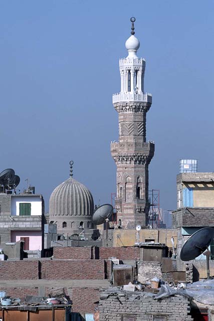 View across rooftops showing minaret after restoration with reconstructed top