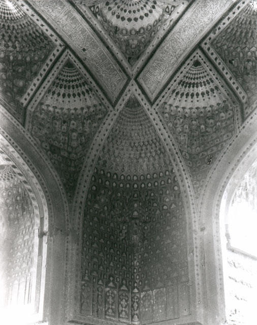 Madrasah-i Gawhar Shad - Interior view of the mausoleum; corner at zone of transition with painted ornament and muqarnas