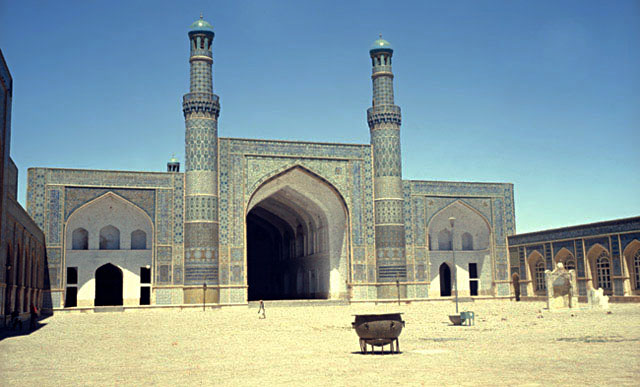 Courtyard view of sanctuary iwan. The namazgah and minbar are seen on the right, and the Kart period cauldron appears in the foreground