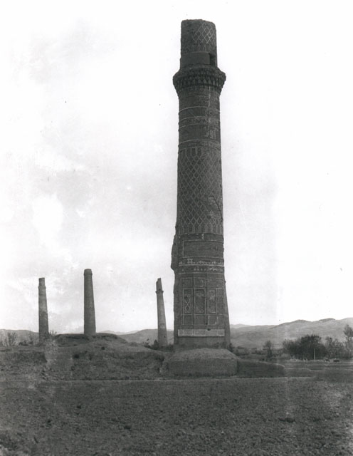 Mosque minaret, with three minarets of Husain Baiqara Madrasa seen in the background