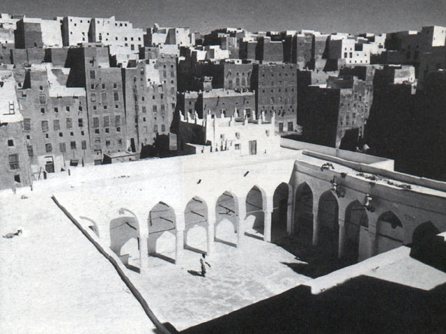 The Great Mosque of Shibam situated in the center of the old city, with the tall tower houses rising around it
