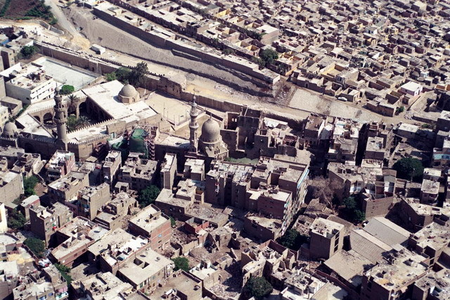 Elevated view of neighborhood from southwest, showing the funerary complexes of Amir Aqsunqur (center left) and Amir Khayrbak (center), and the ruined Alin Aq Palace adjoining the Khayrbak Complex