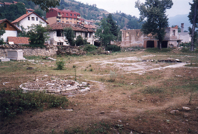 The empty site of the mosque with the outline of its foundation in the foreground, after it was bombed and bulldozed in April 1992 by Bosnian Serb extremists