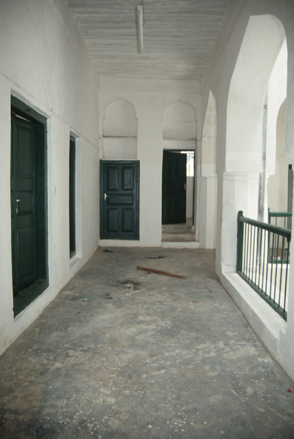 View along covered gallery surrounding courtyard