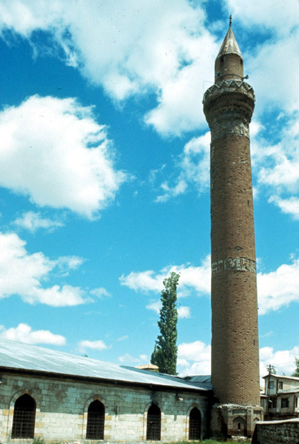 Exterior view from southwest, showing minaret and qibla wall