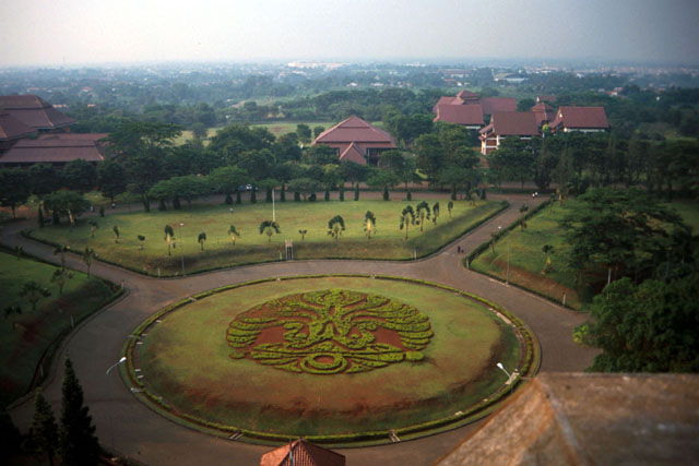 Aerial view showing manicured lawns and decorative plantings of roundel around which buildings are set