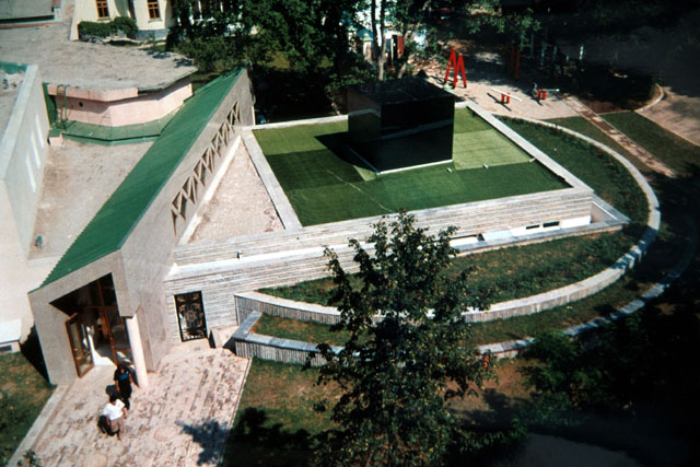 Aerial view showing cube set on landscaped plinth