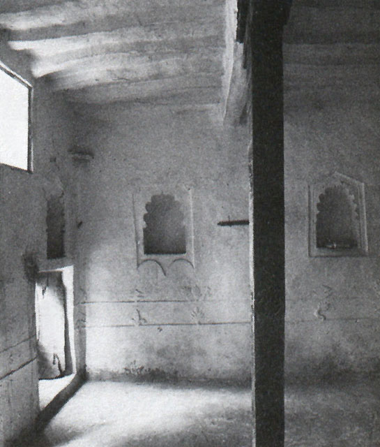 Part of an upper room in the house with its windows at floor level to permit people sitting on the floor to look down to the street