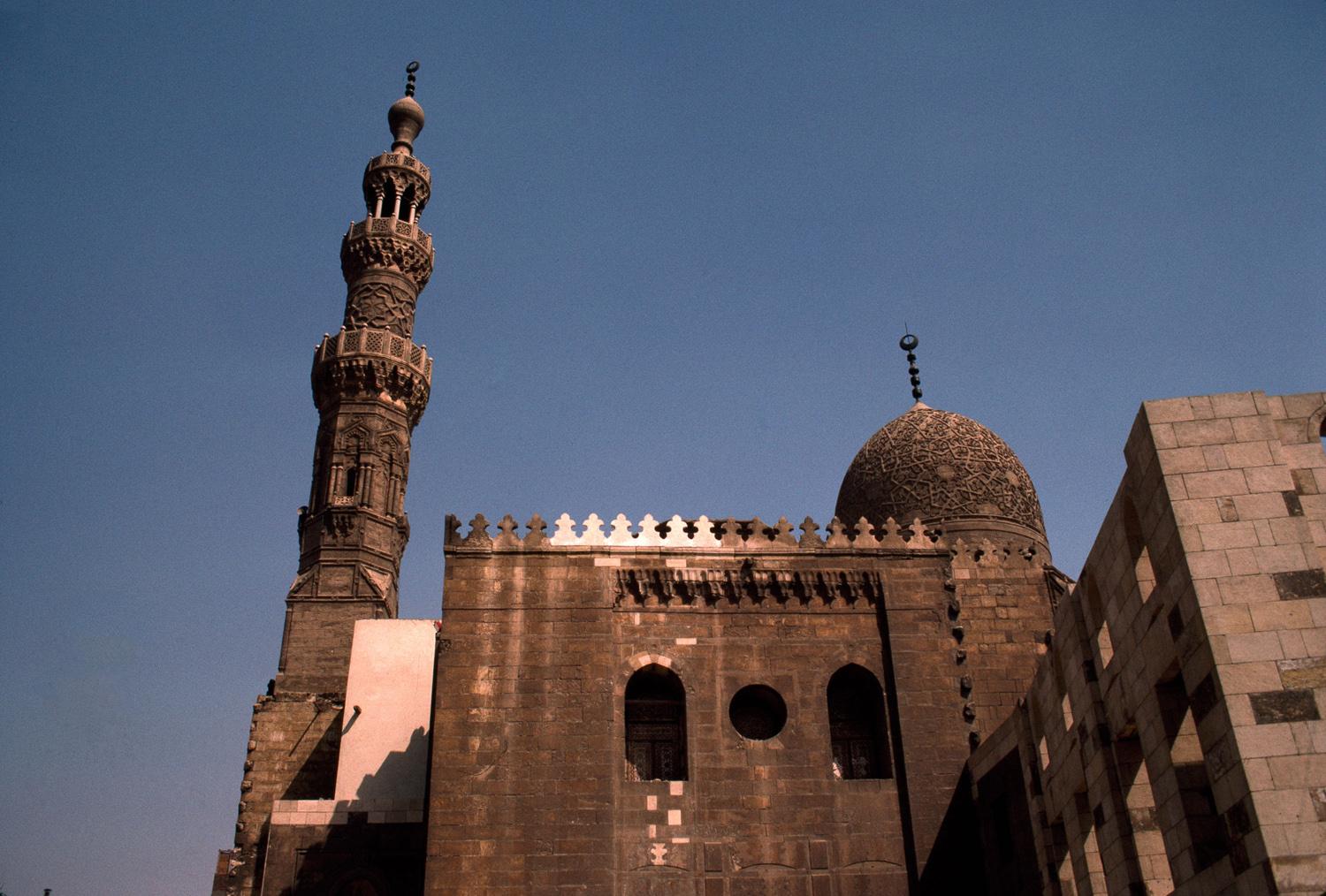 Upper zone, west façade of mosque and carved stone dome