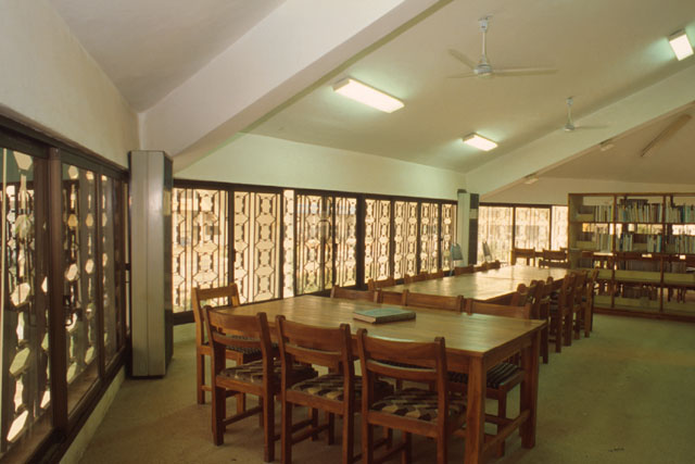 Interior view showing wooden screens filtering light to reading area