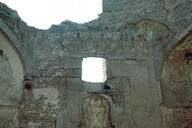 Interior view, showing muqarnas hood of mihrab with remains of the zone of transition