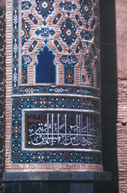 Detail of north minaret; lower section with tile inscription and arabesque motifs