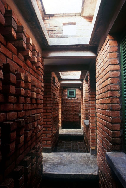 Interior view along brick corridor