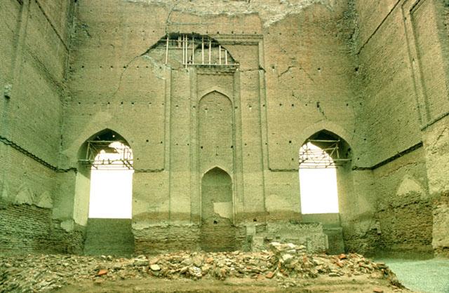 Arg-i Alishah - Interior view of qibla wall from north showing the mihrab at the center of the three relieving arches and the two openings at the sides