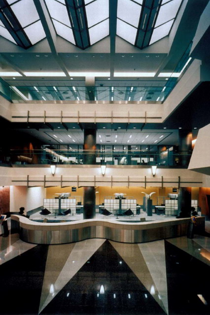 Three story atrium of branch bank serpentine information counter, luminous accordion-shaped ceiling