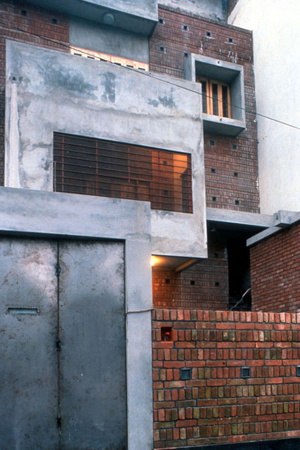 Exterior view of façade showing concrete and brick