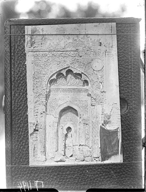 Photograph, attached to a board, of a mihrab