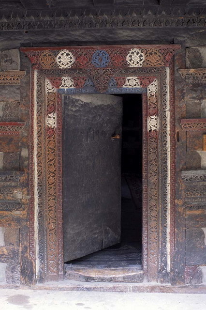 Khilingrong Mosque Restoration - Mosque portal with carved and painted wooden frame, after restoration