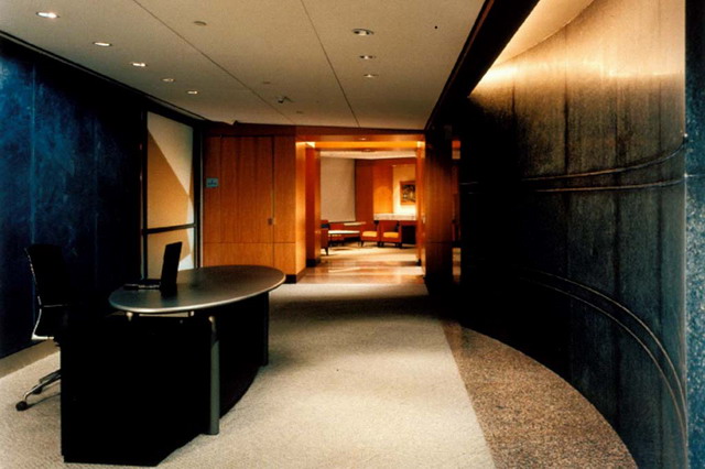 Greeting and information area on the executive meeting floor, curvilinear wall of granite