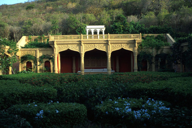 Exterior view, showing pavilion in garden setting