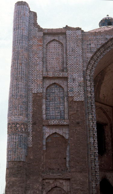 Aq Mazar - Tiled blind niches and engaged columns flanking entry portal