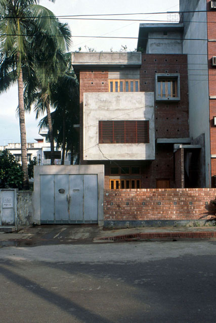 Exterior view showing concrete and brick façade