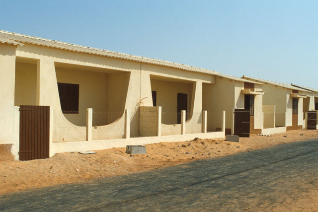 Exterior view showing modular façades with covered terraces