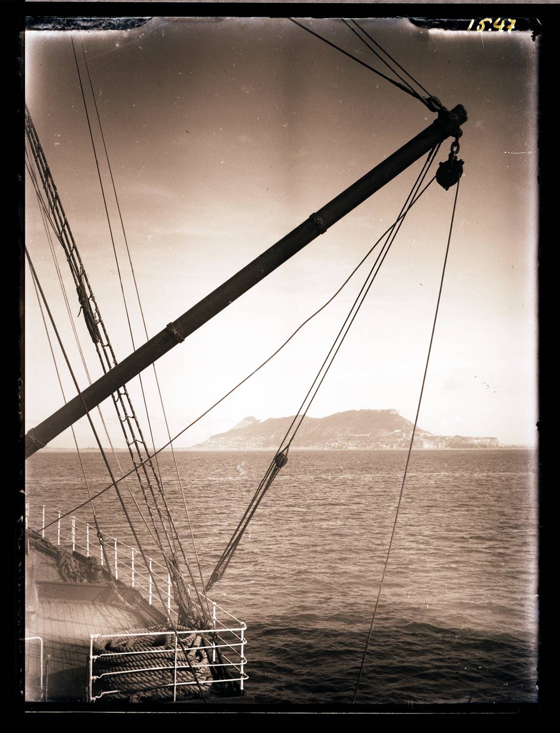 View of the Rock of Gibraltar past the ship's rigging in the foreground