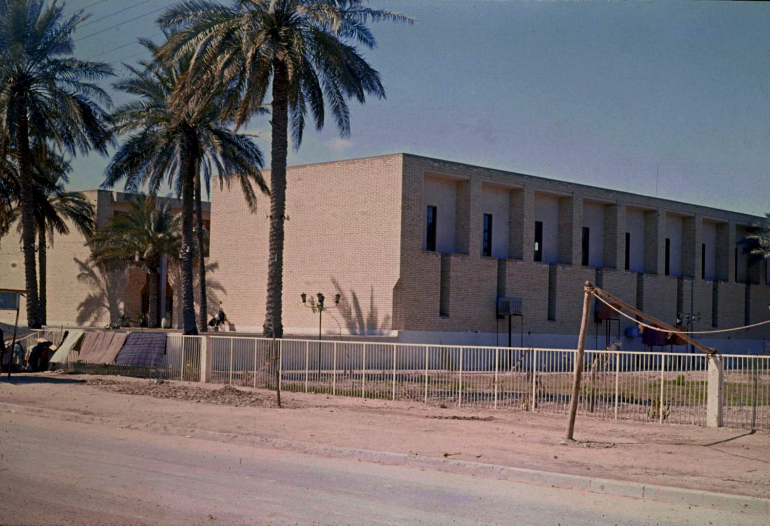 <p>View of east corner showing entrance facade and northeast side of building</p>