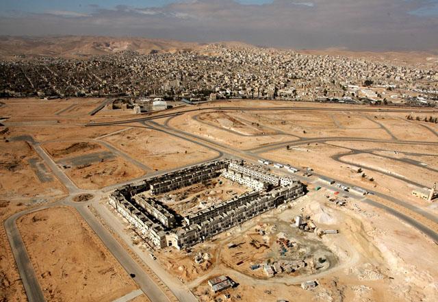 Aerial view of the project during construction showing the city of Zarqa in the background