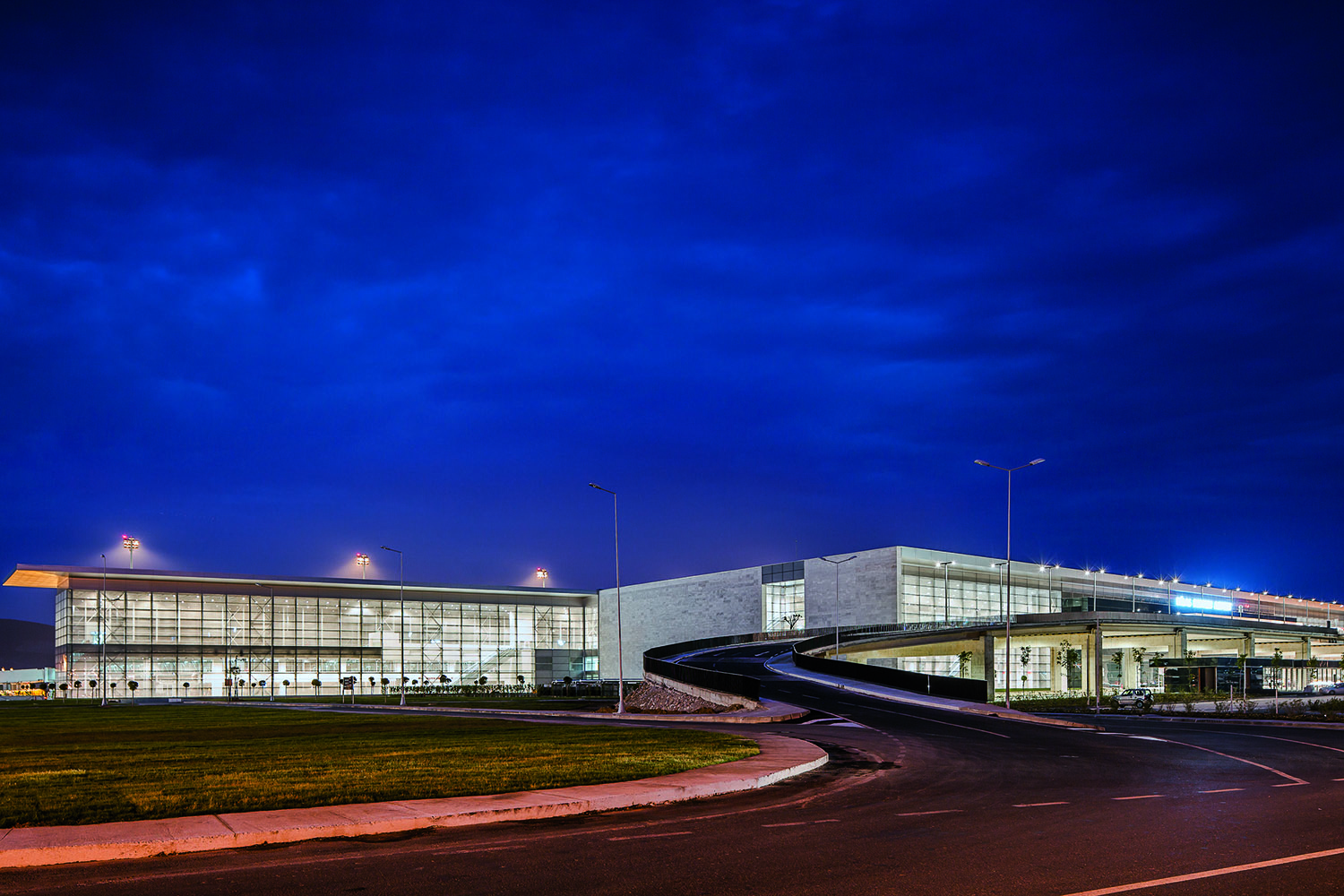 <p>Airport main facade view at night</p>